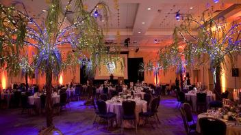 Ballroom dining setup with custom decorations